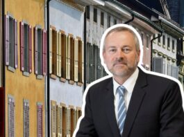 « Les propriétaires ne pourront plus agir sans scrupules » Illustration : un homme en costume-cravate, en surimpression au premier plan, fait face à une rangée de façades de logements anciens aux murs jaune, blanc et pastel, agrémentées de volets colorés (rouges, verts, jaunes).